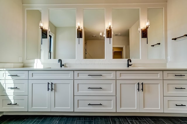 full bath with a sink and double vanity