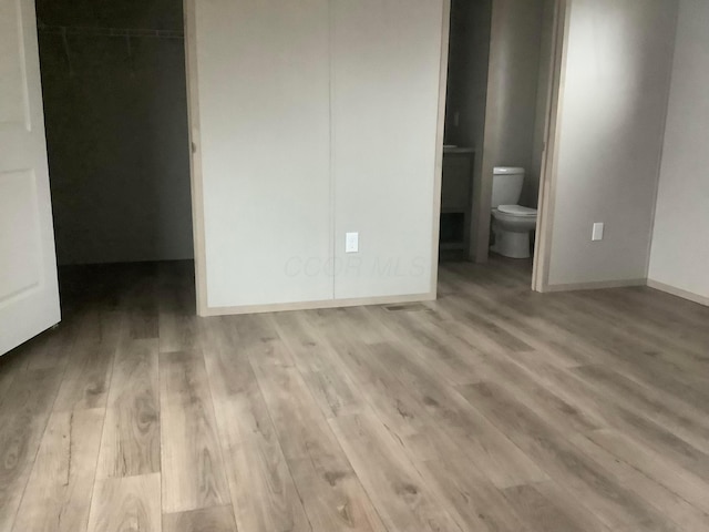 8565 Smith Calhoun Rd Unit 172, Plain City, OH 43064 - unfurnished bedroom featuring wood finished floors and connected bathroom