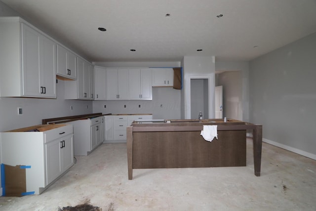 kitchen featuring white cabinets and a kitchen island