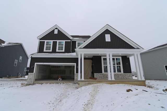 craftsman inspired home with a porch and a garage