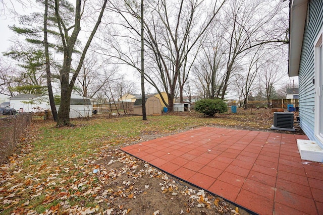 view of patio / terrace featuring cooling unit and a storage unit