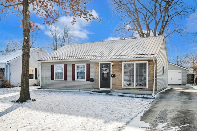 view of front facade featuring an outbuilding and a garage