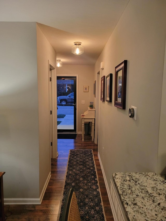 hallway featuring dark hardwood / wood-style floors