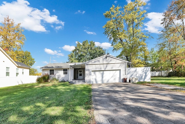 view of front of home with a garage and a front yard