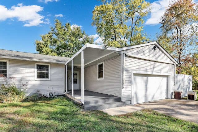 view of front of home with a garage and a front lawn