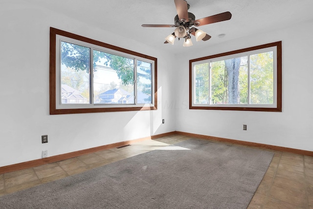 empty room featuring ceiling fan