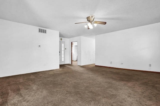 carpeted spare room featuring ceiling fan and a textured ceiling