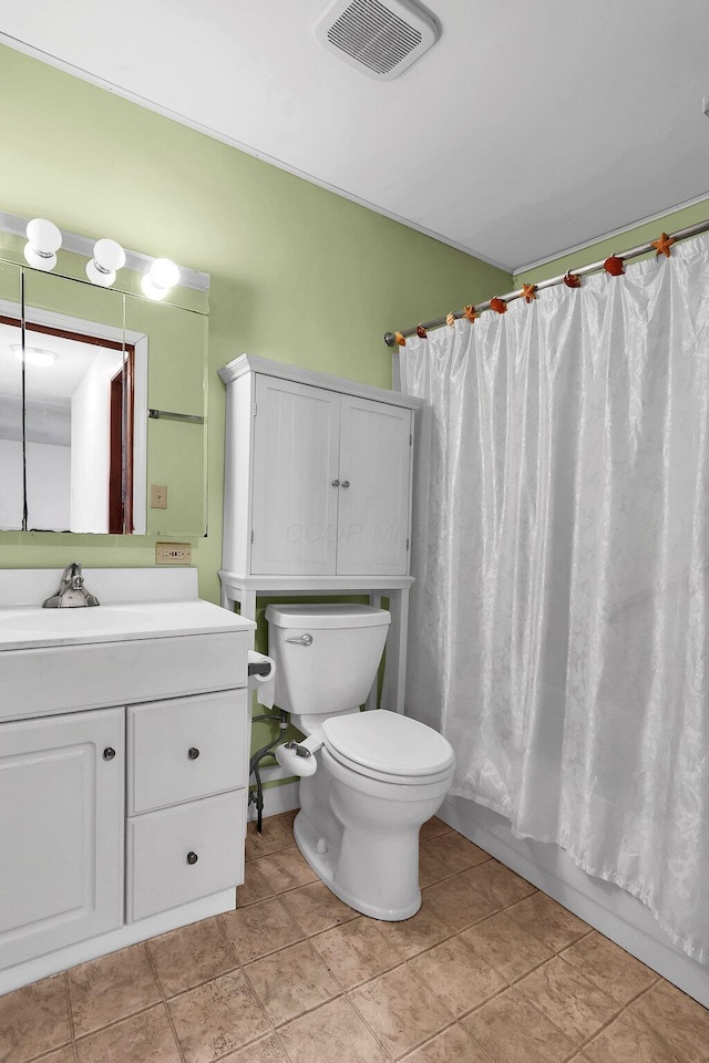 full bathroom featuring tile patterned floors, vanity, toilet, and shower / bathtub combination with curtain