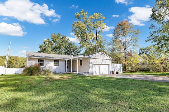 view of front facade featuring a front lawn and a garage