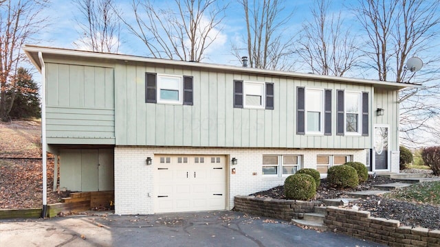 split foyer home featuring a garage