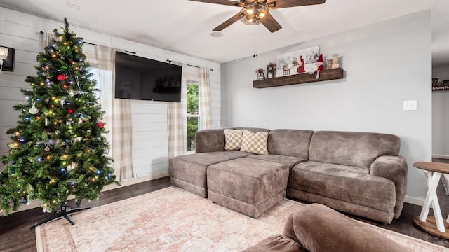 living room featuring hardwood / wood-style flooring and ceiling fan