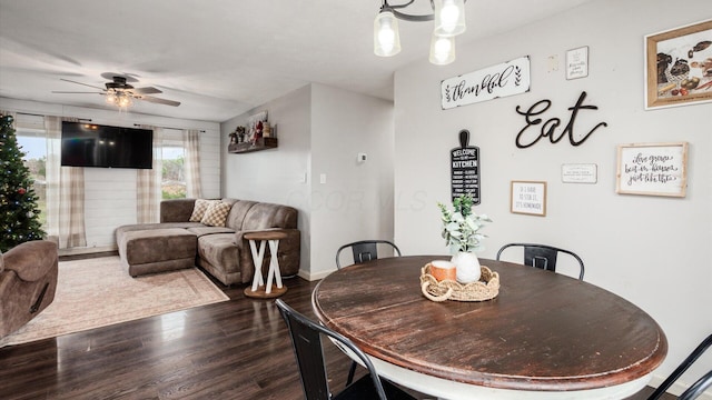 dining area featuring ceiling fan and wood-type flooring