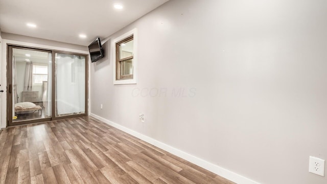 spare room featuring light wood-type flooring