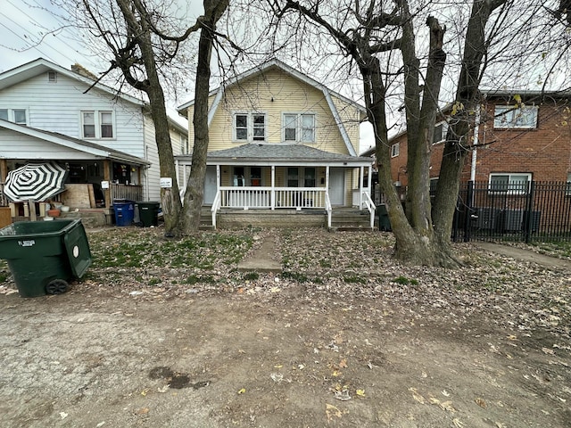 rear view of house with covered porch