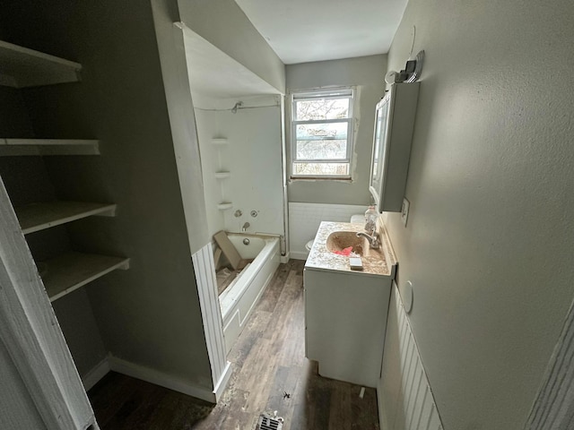 bathroom with vanity, wood-type flooring, and tub / shower combination