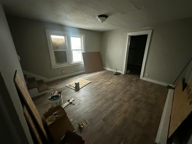 spare room with wood-type flooring and a textured ceiling