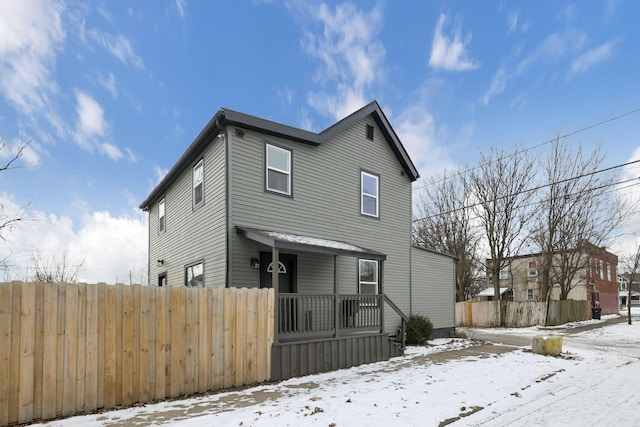 view of snow covered house