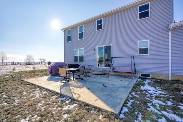 back of property featuring a patio