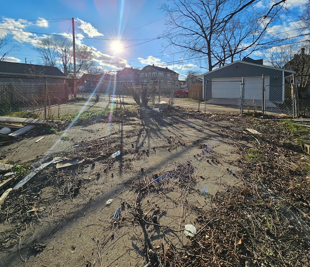 view of yard featuring an outbuilding and a garage