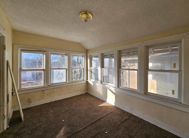 unfurnished sunroom with lofted ceiling