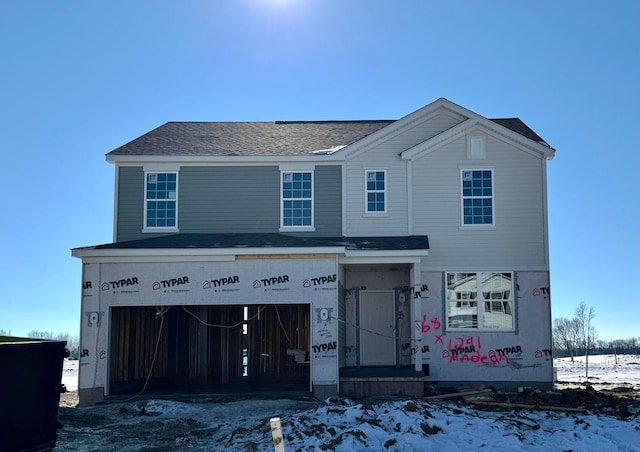 unfinished property with a garage