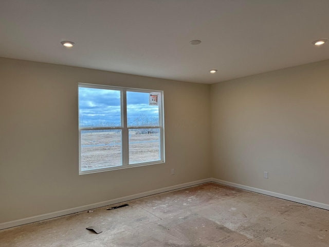 spare room with visible vents, baseboards, and recessed lighting