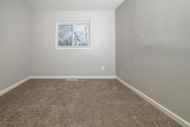 unfurnished room featuring carpet floors