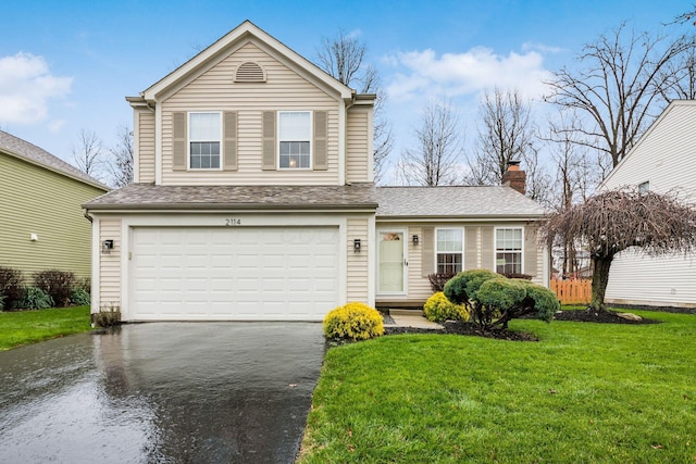 front facade featuring a garage and a front yard