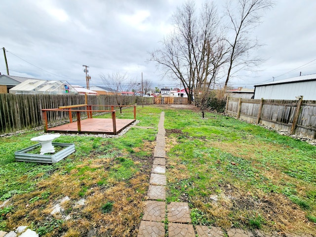 view of yard with a wooden deck