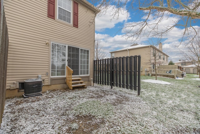 exterior space with a lawn and cooling unit