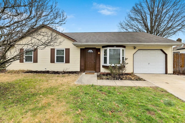 ranch-style house with a garage and a front yard