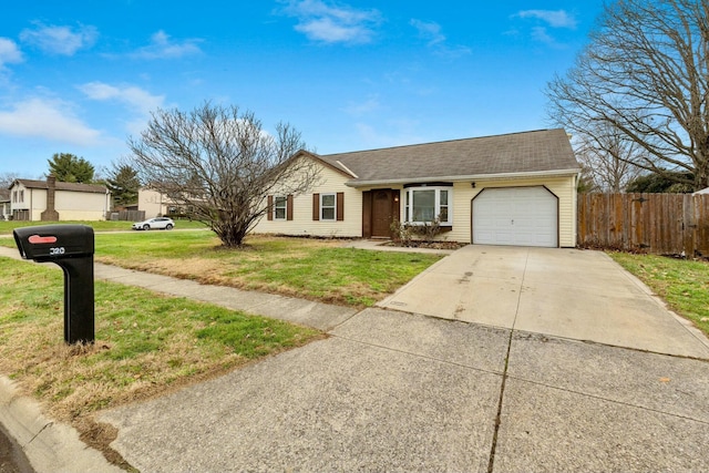 ranch-style house featuring a front yard and a garage