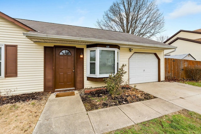 doorway to property featuring a garage