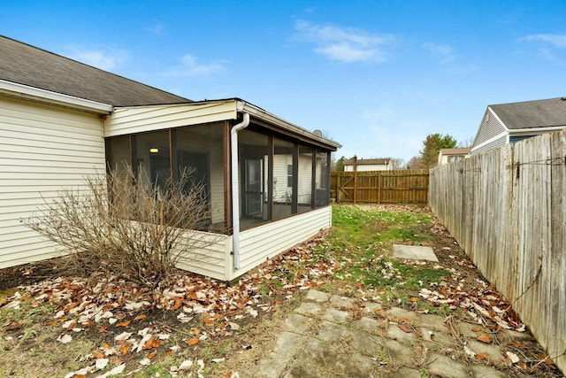 view of yard featuring a sunroom