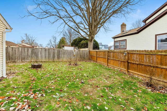 view of yard with an outdoor fire pit