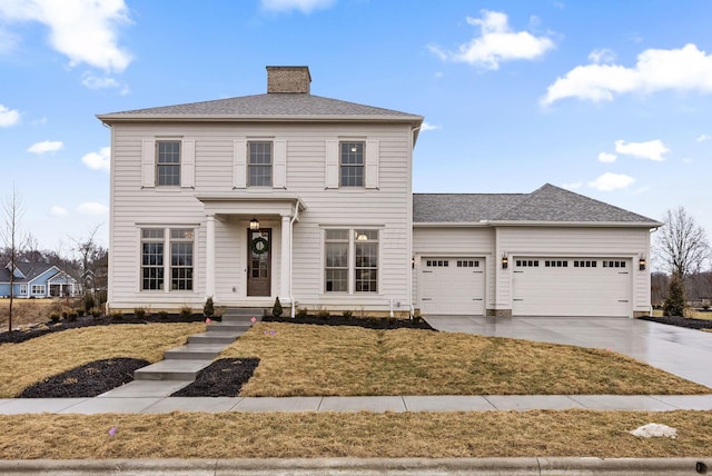 view of front of property with concrete driveway, a chimney, roof with shingles, an attached garage, and a front lawn