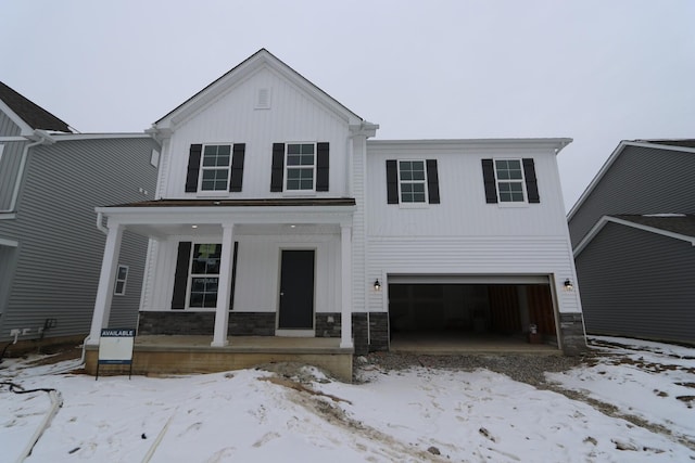 view of front of house with covered porch and a garage