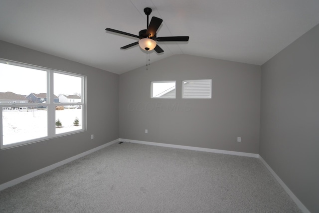 unfurnished room featuring lofted ceiling, carpet flooring, and ceiling fan