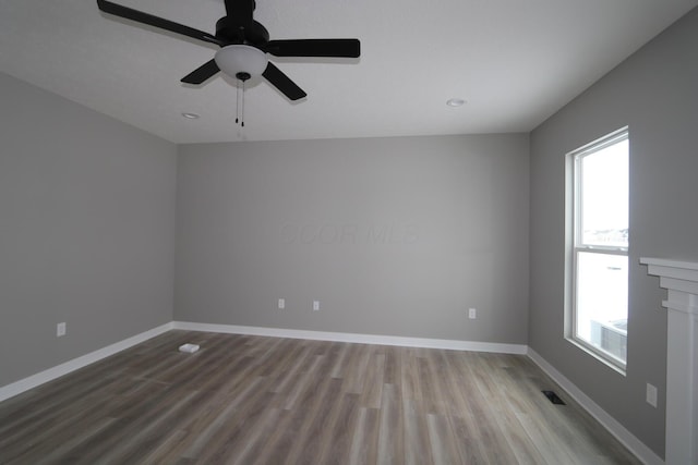 unfurnished room with light hardwood / wood-style floors and ceiling fan