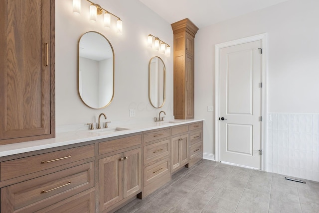 bathroom with tile patterned flooring and vanity