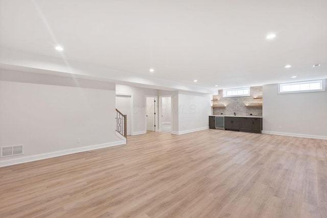 basement featuring light hardwood / wood-style floors