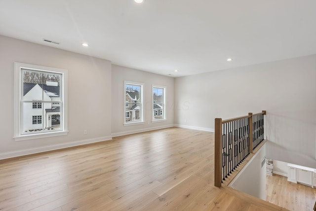 spare room featuring light hardwood / wood-style floors