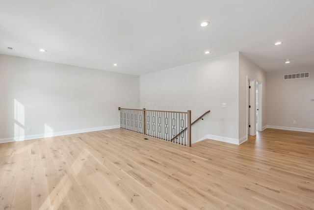 unfurnished room featuring light hardwood / wood-style floors