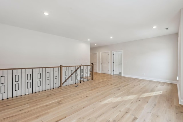 spare room with light hardwood / wood-style floors