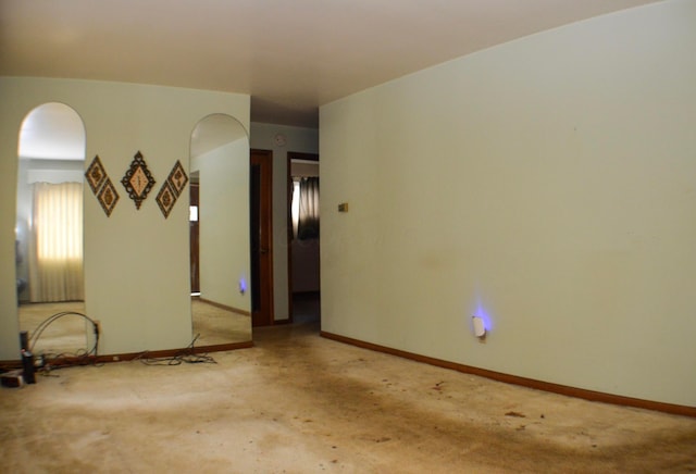 spare room with light carpet