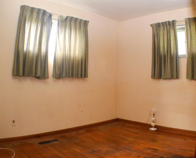 spare room featuring hardwood / wood-style floors