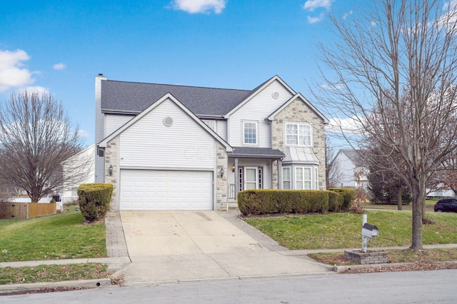 traditional-style house featuring a garage, stone siding, concrete driveway, a front lawn, and a chimney