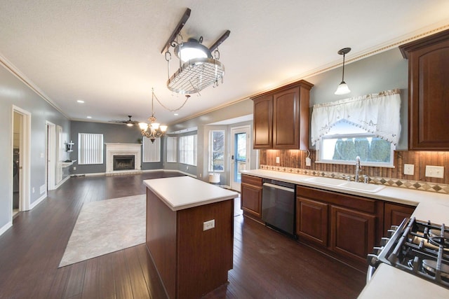 kitchen with a sink, a kitchen island, dark wood-style flooring, and stainless steel dishwasher