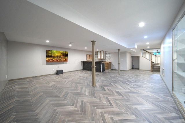 finished basement featuring recessed lighting and stairs