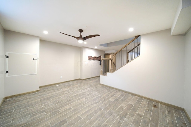 spare room with stairs, ceiling fan, wood finished floors, and recessed lighting